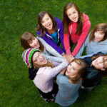 6 teenage girls and a twenty something councelor (20s woman with hat).
